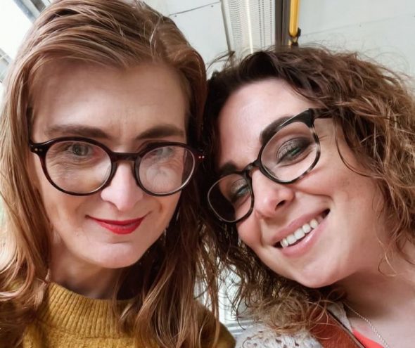 Rachel and Cath - Two femme presenting people in glasses, both white with brownish hair, Rachel's is slightly reddish as well